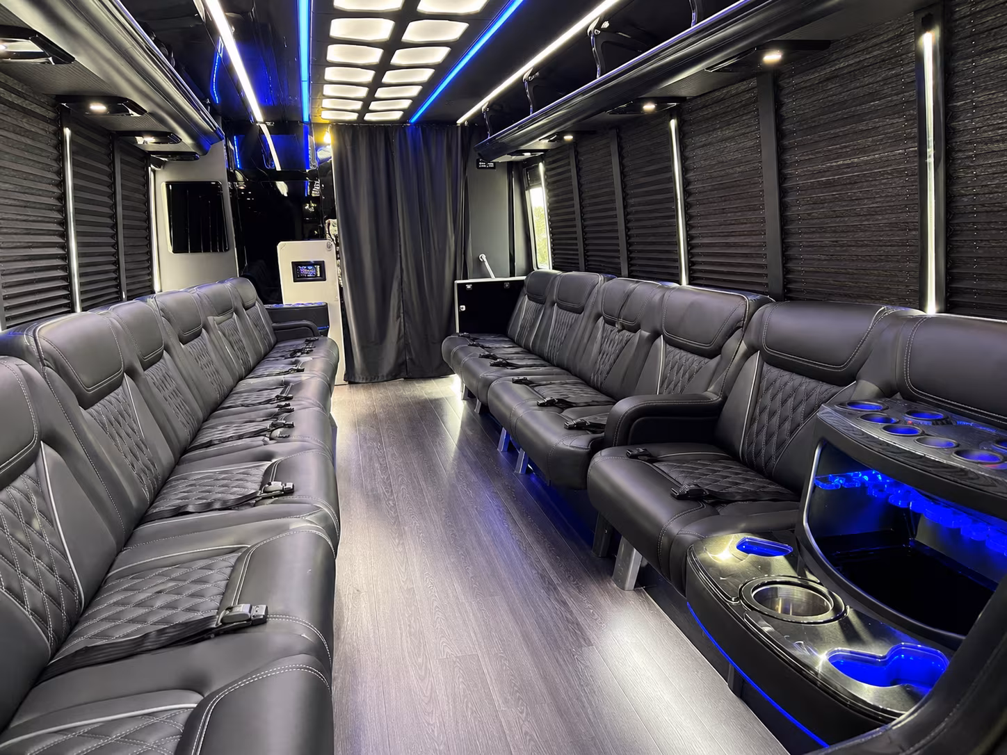 Friends laughing during a party bus celebration in Daly City